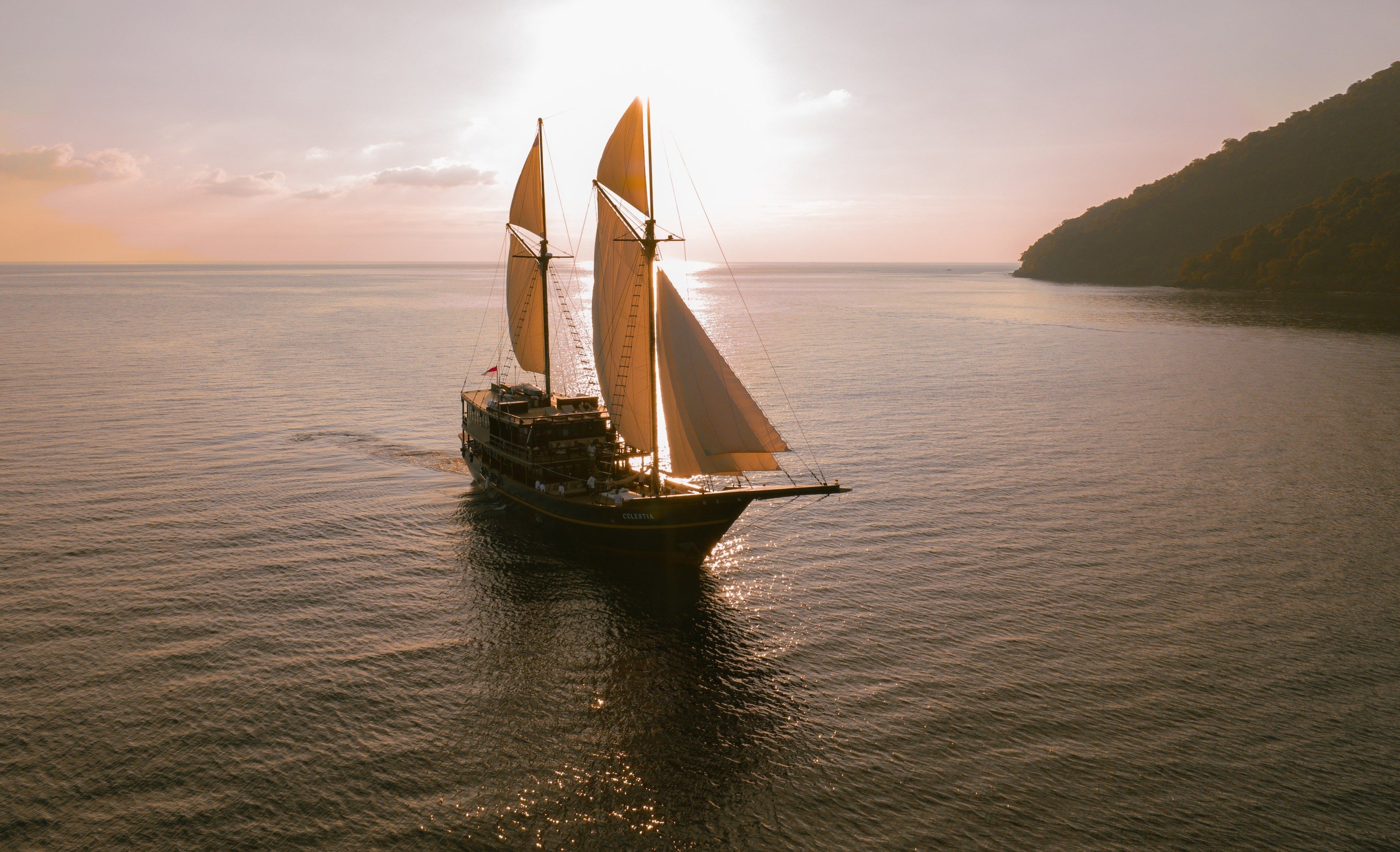 Celestia under golden sails in the evening light