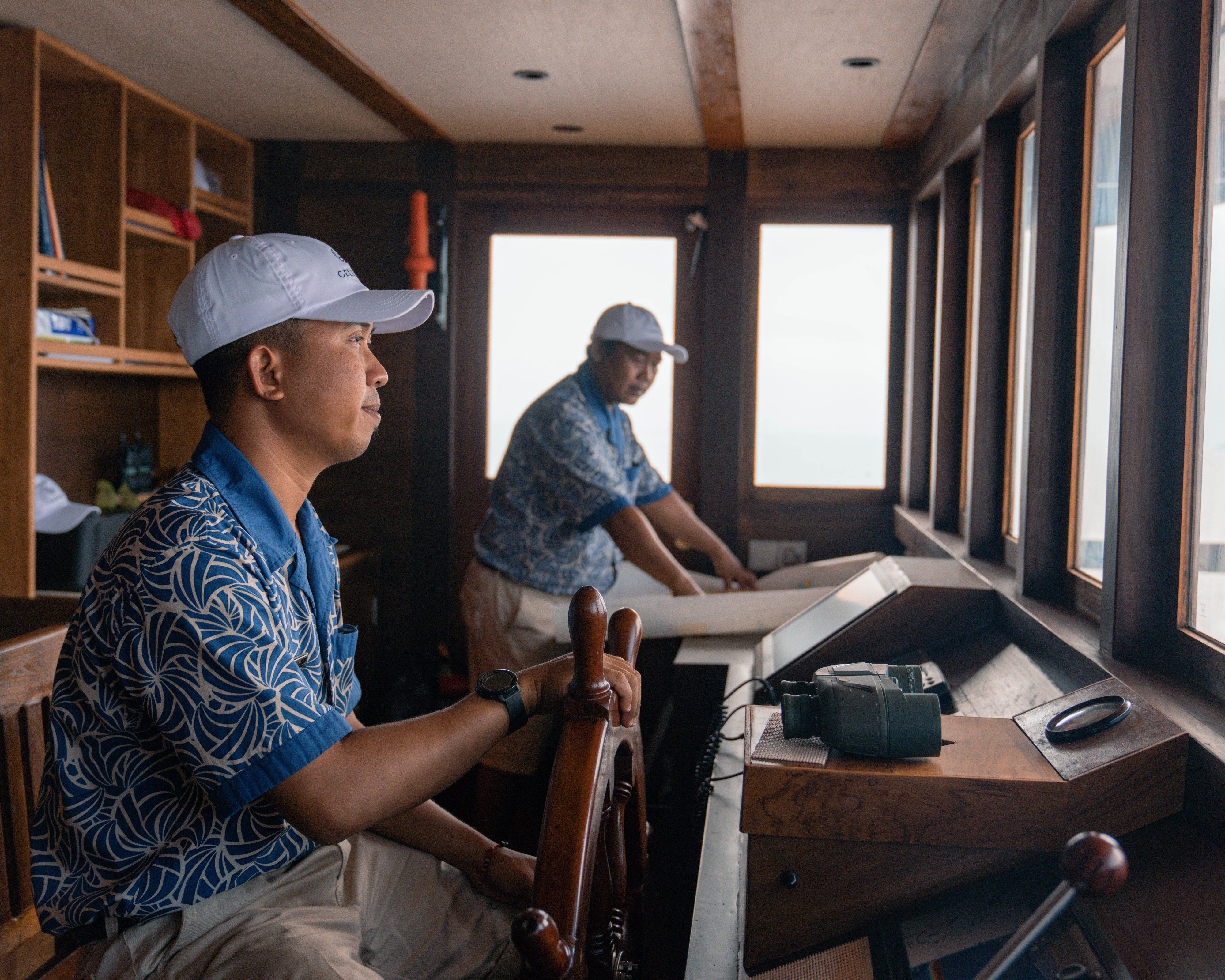 The captain at the helm, with the crew close at hand.
