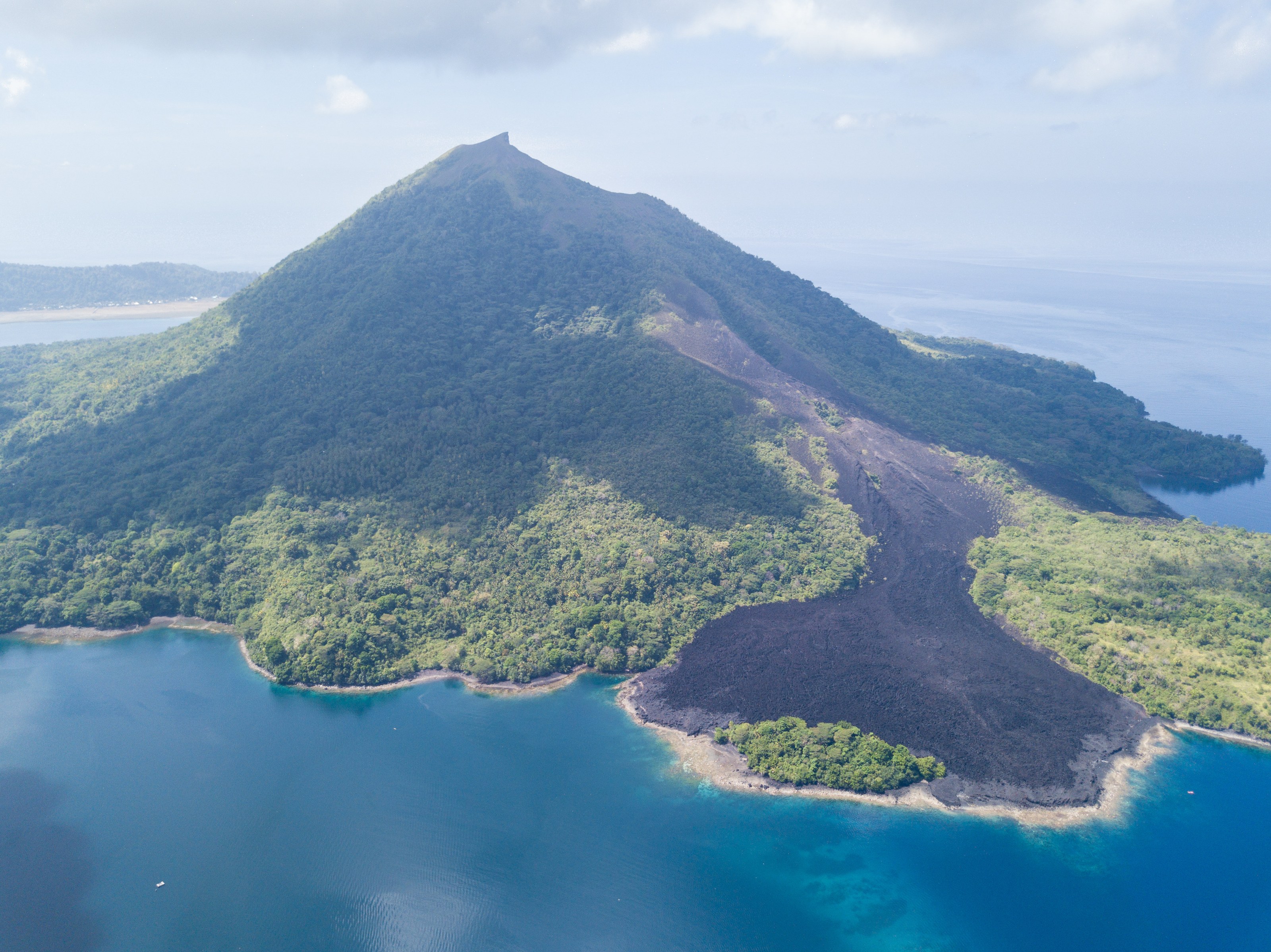 The lava-scarred slopes of Banda Api rising from the sea