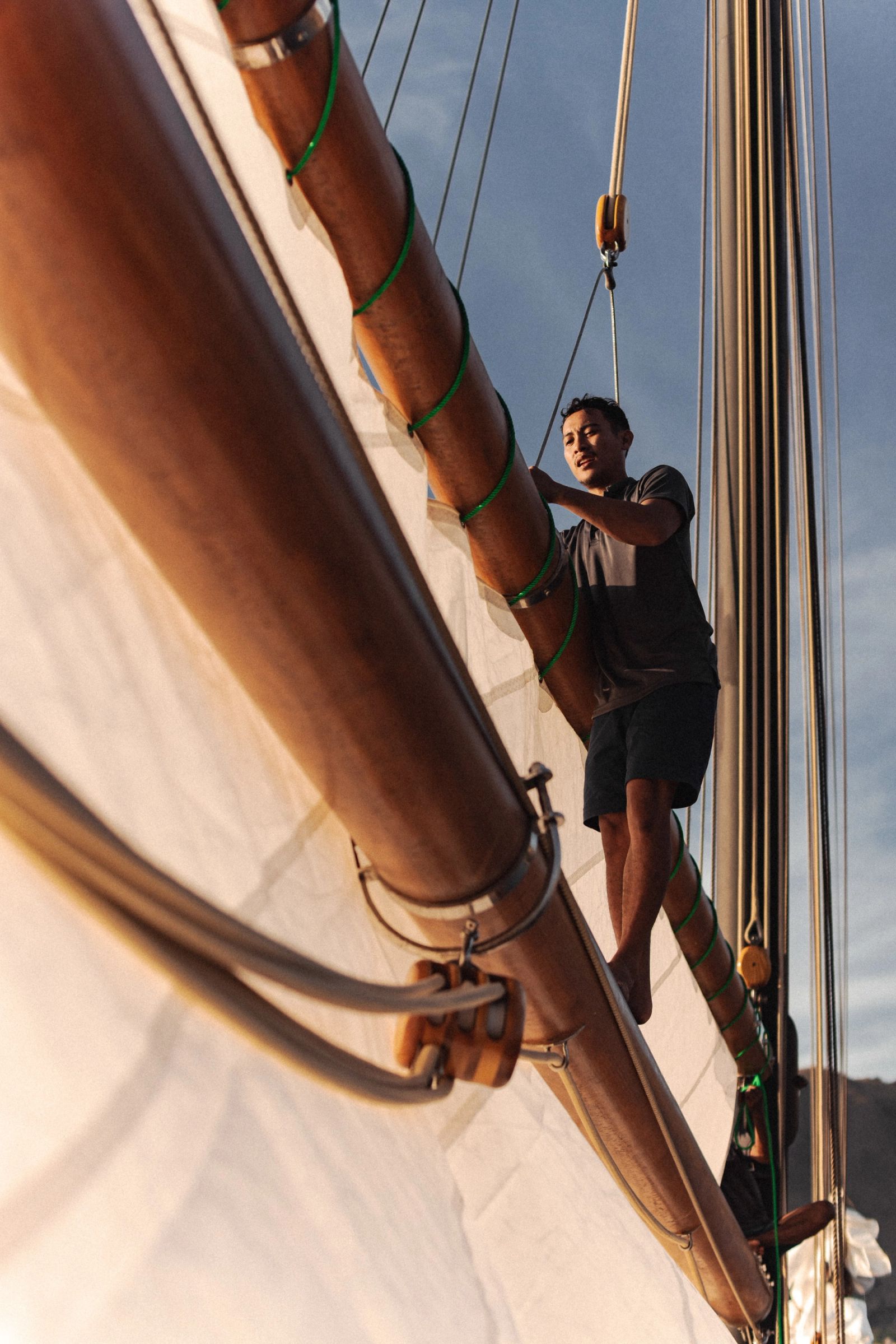 A Vela crew member standing in the rig at the gaff