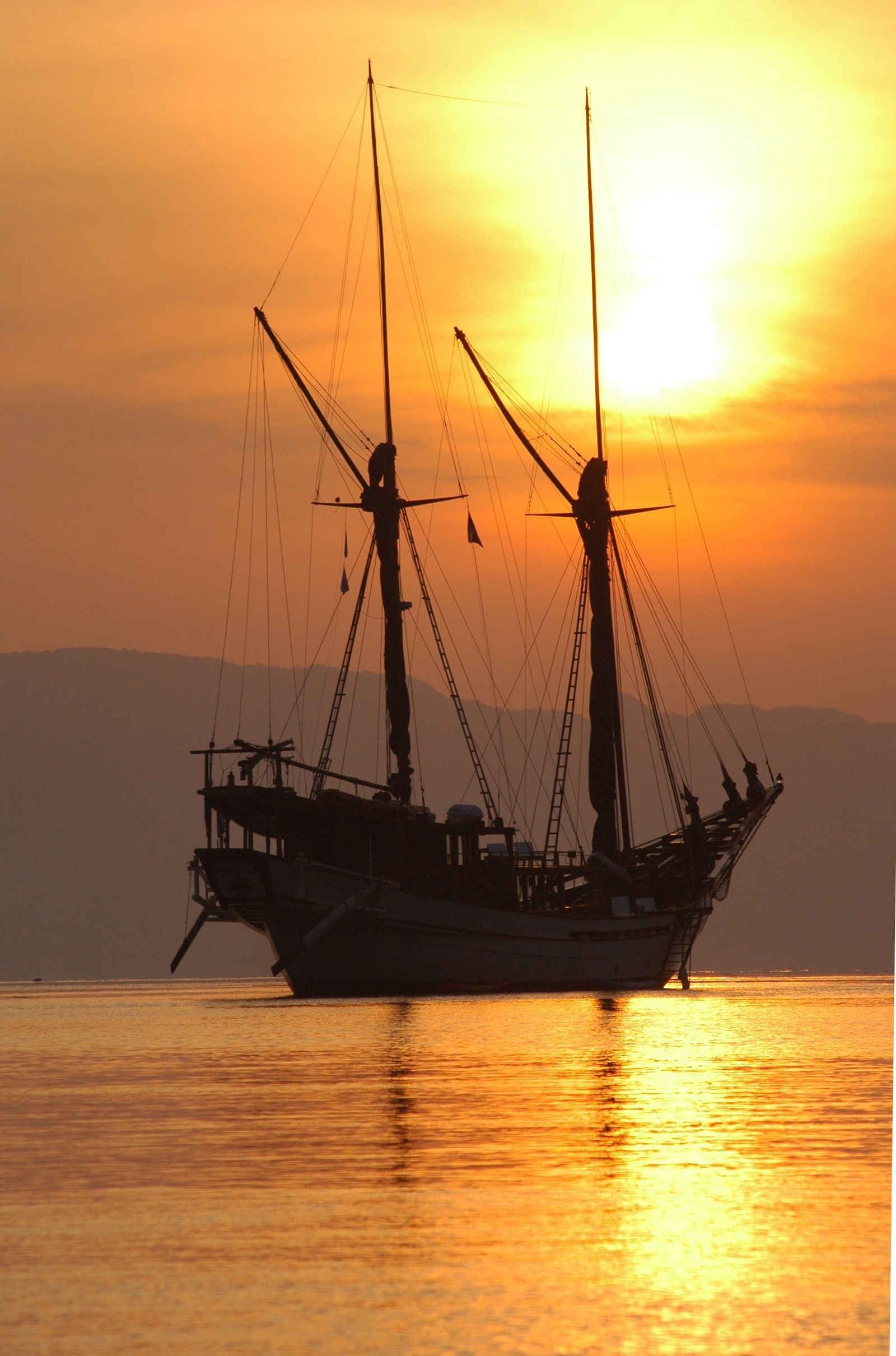Silolona at anchor in golden light
