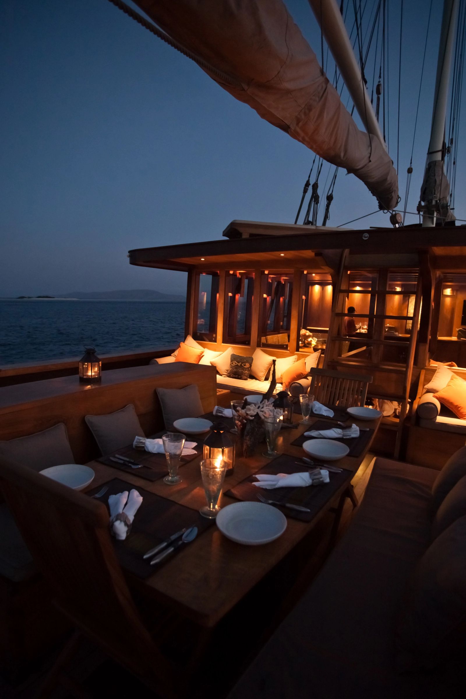 Si Datu Bua's deck dining table set at dusk
