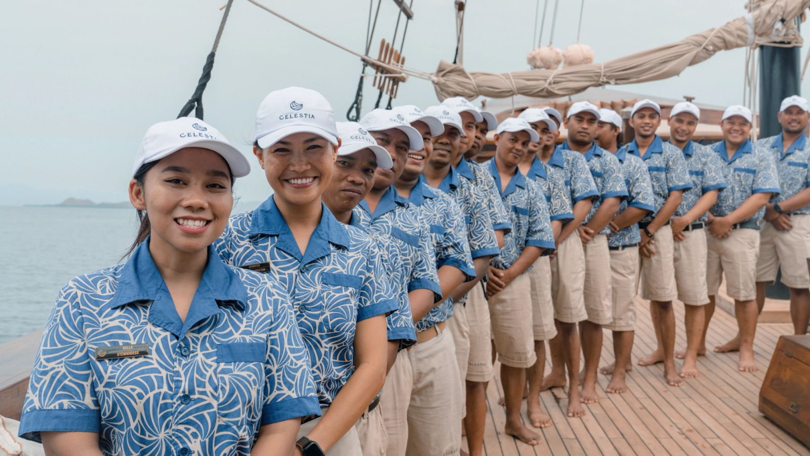 Celestia's crew in uniform lined up along the deck
