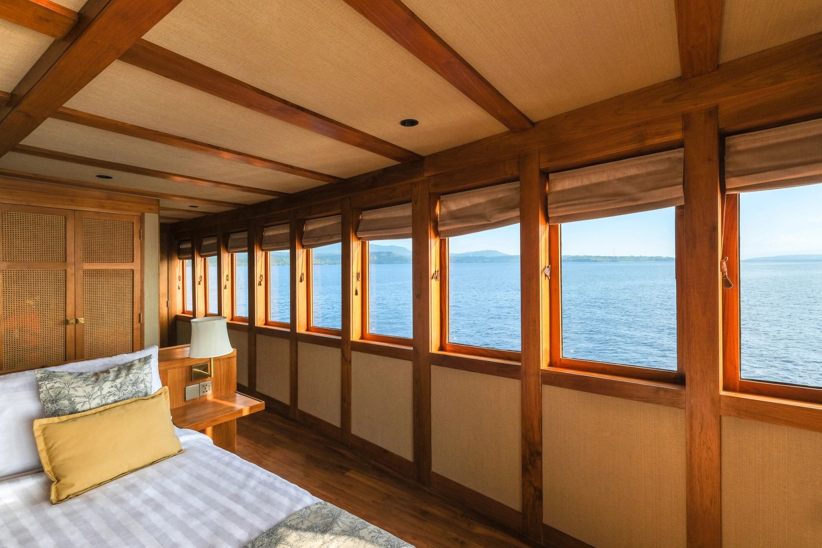 A stateroom aboard Celestia lined with windows