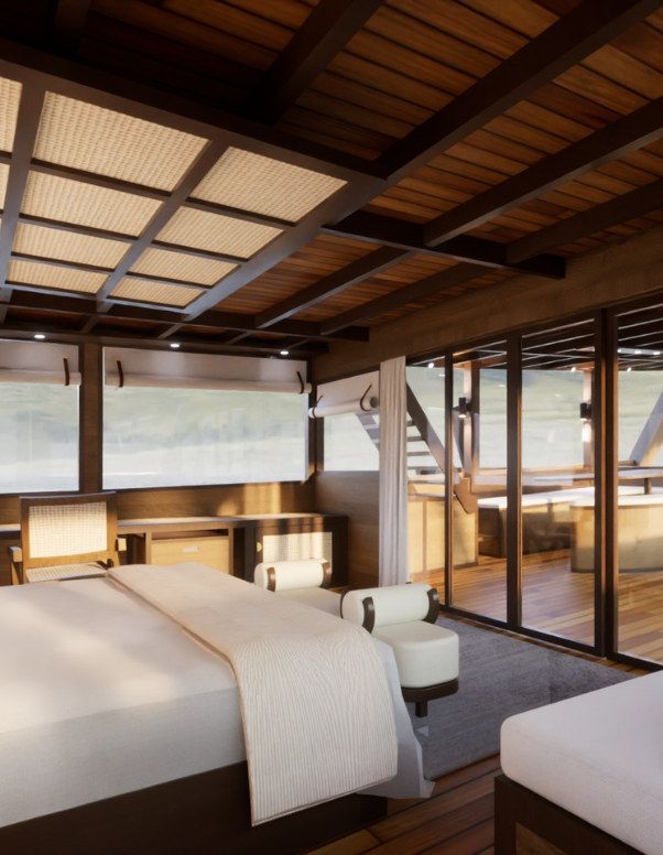 The master cabin on Sanya with a king bed and tall windows in a narrow crop.