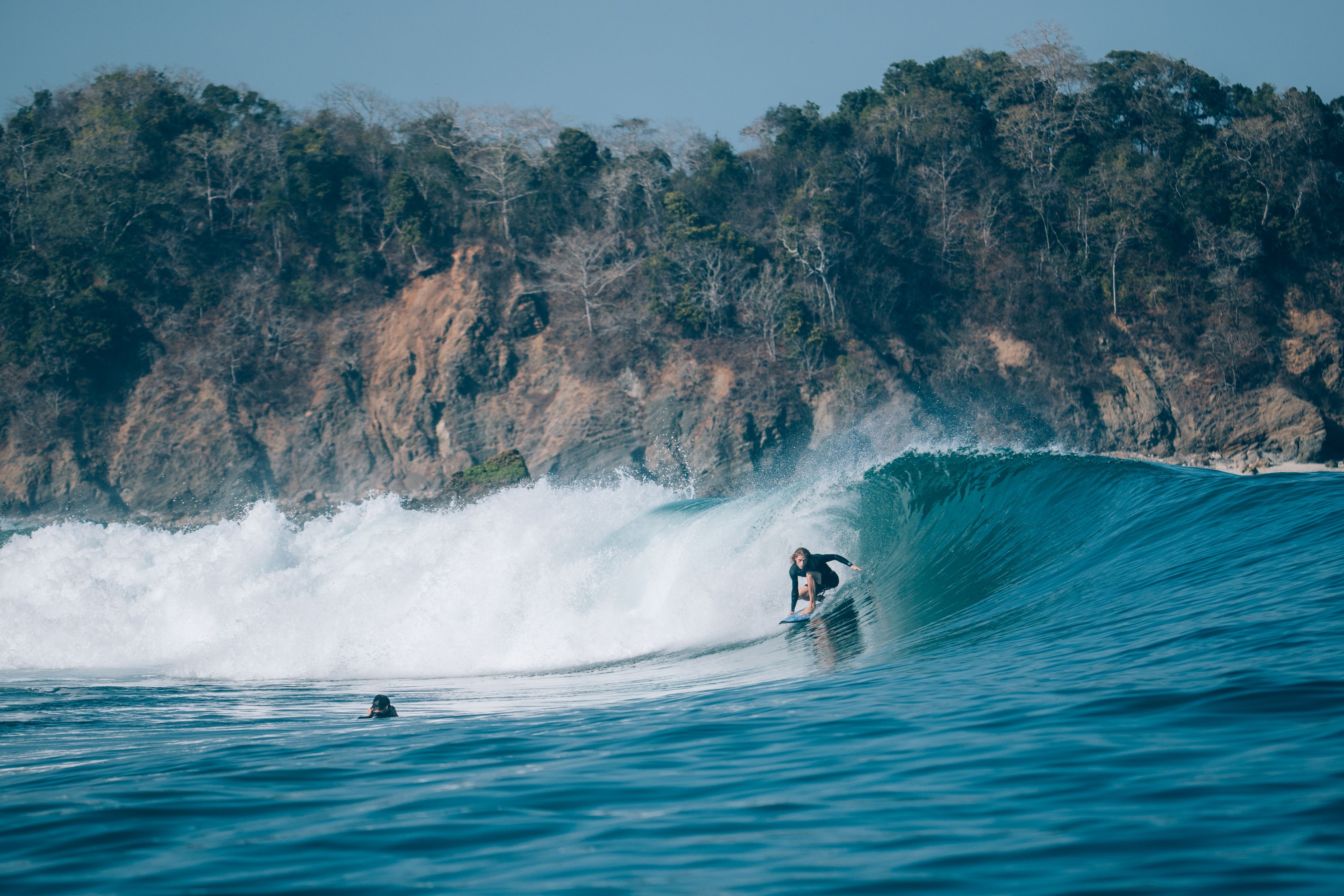 A surfer inside a barrel off Sumba's south coast