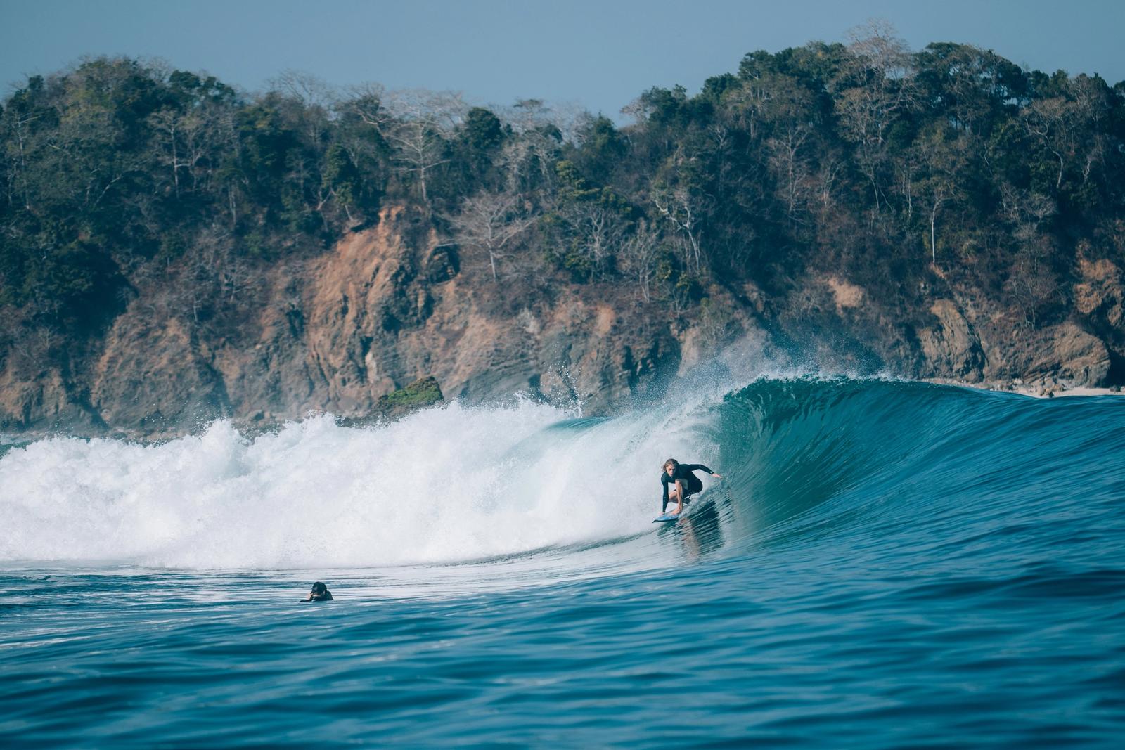 A surfer inside a barrel off Sumba's south coast