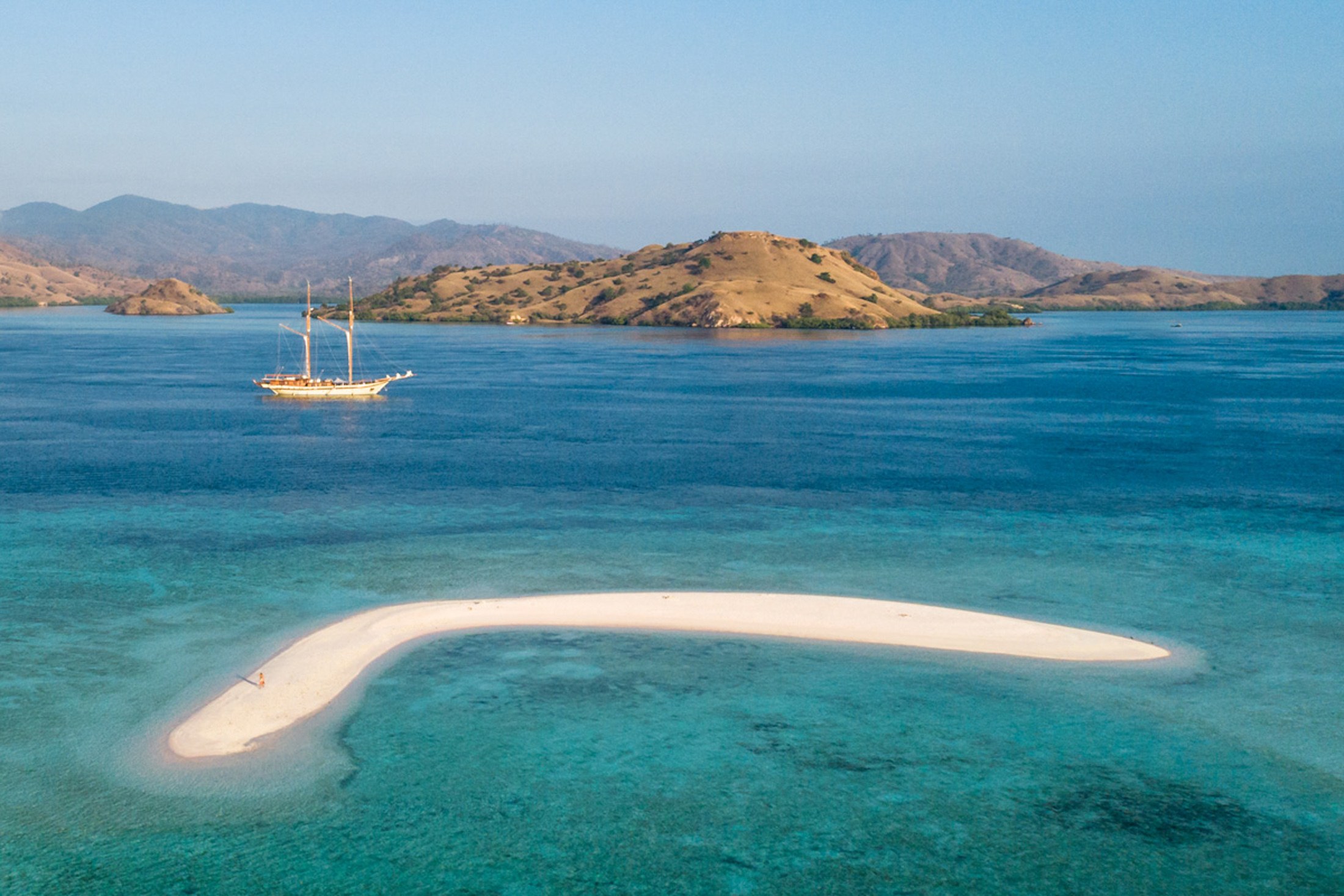 Lamima at anchor beyond a Komodo sandbank
