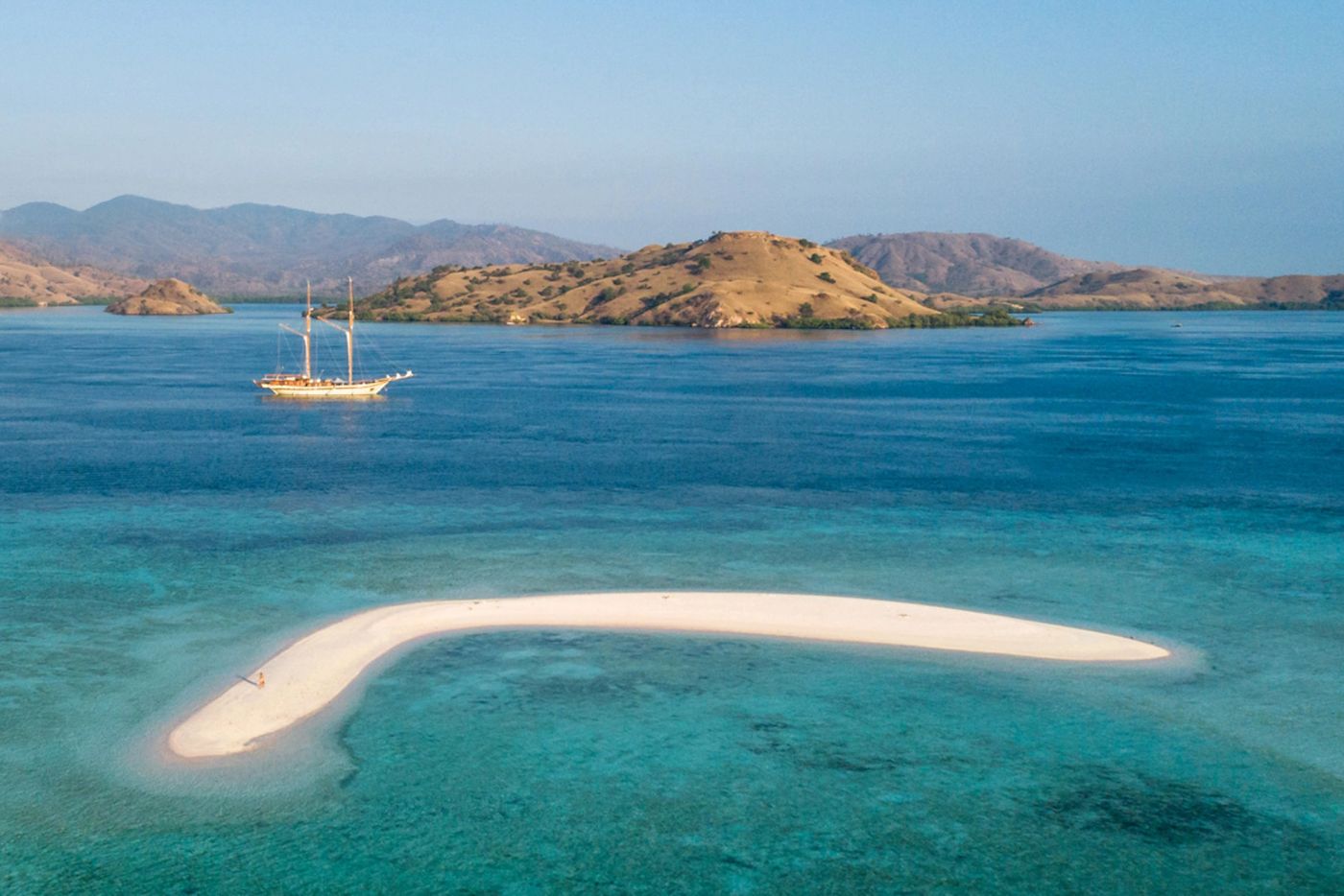 Lamima at anchor beyond a Komodo sandbank