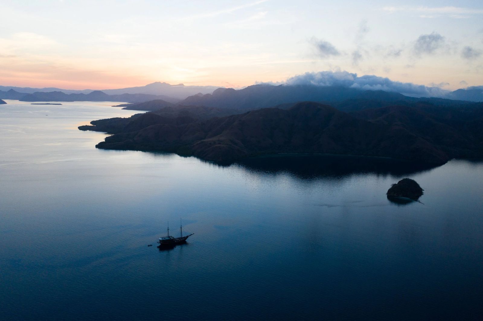 Dunia Baru at dusk in a Komodo anchorage