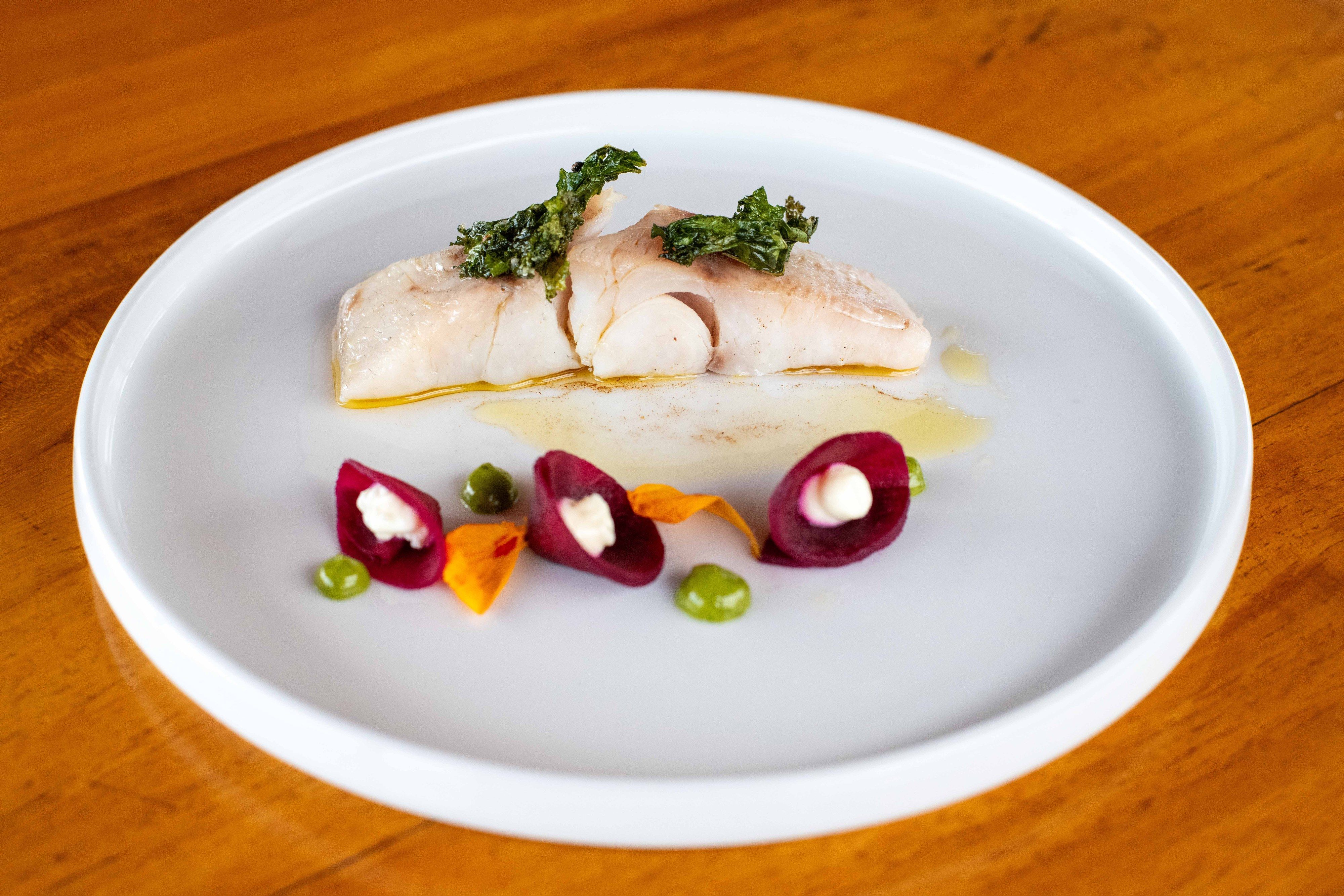 A plated fish course from the day's catch.