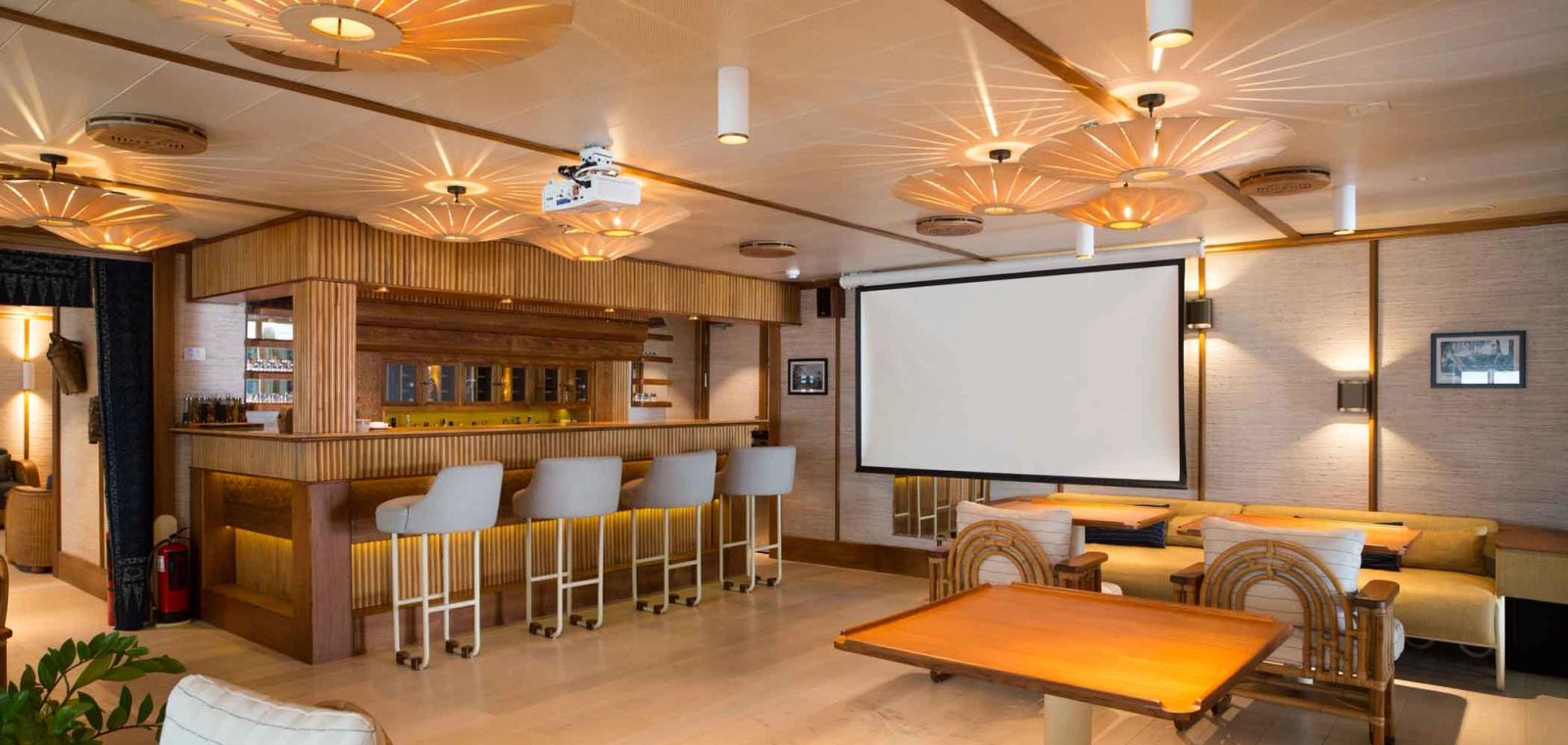 The main deck dining area and bar also doubles as a screening room with projector.