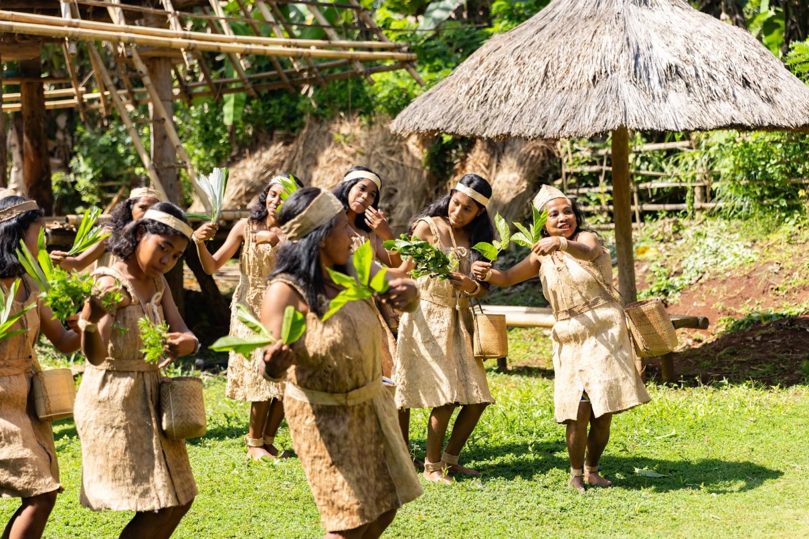 Dancers receiving guests at a highland longhouse