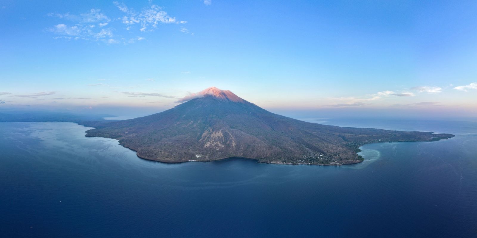 A volcano rising from the sea along the eastern arc