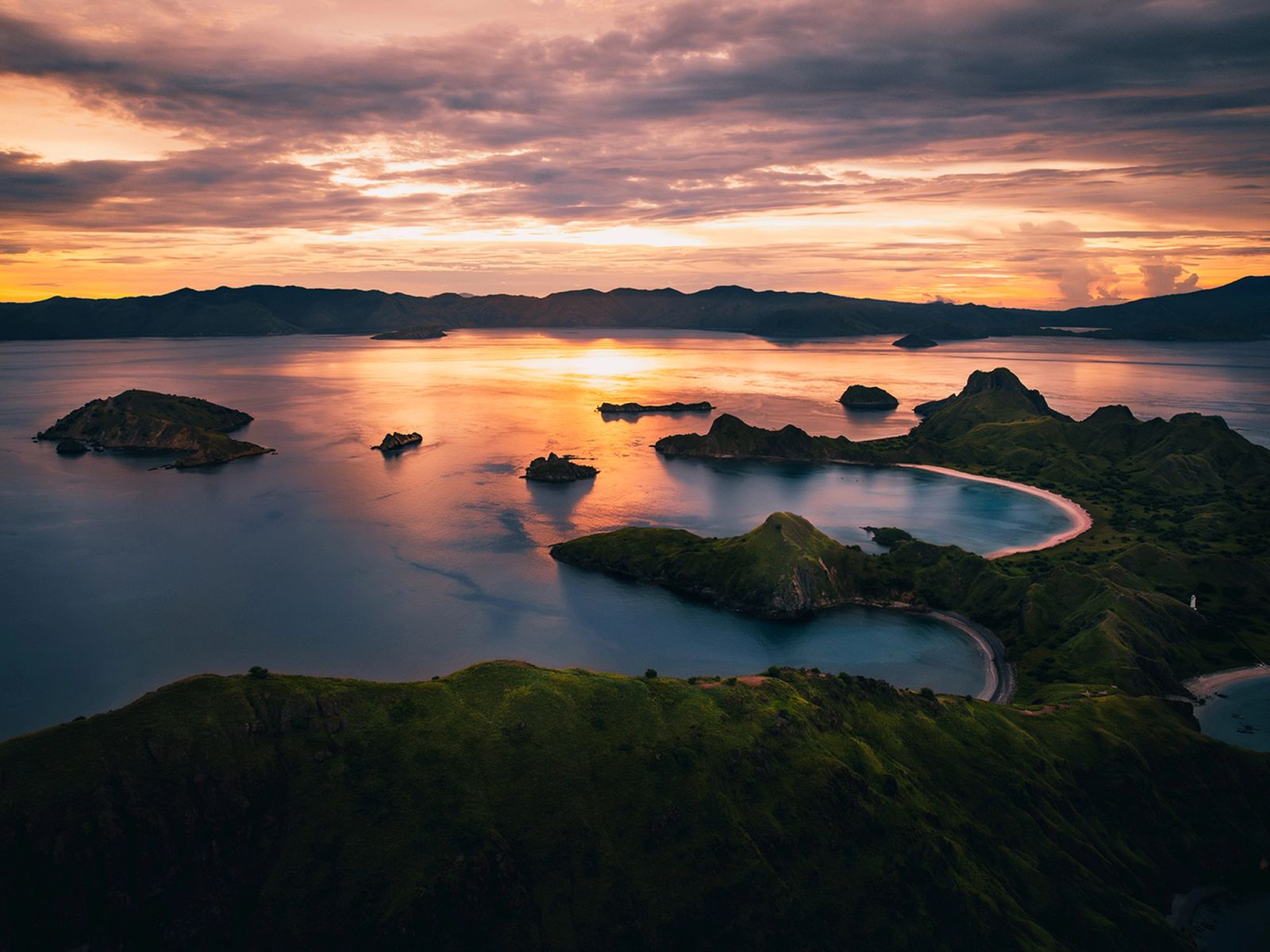 The bays of Padar Island at sunset, seen from the air