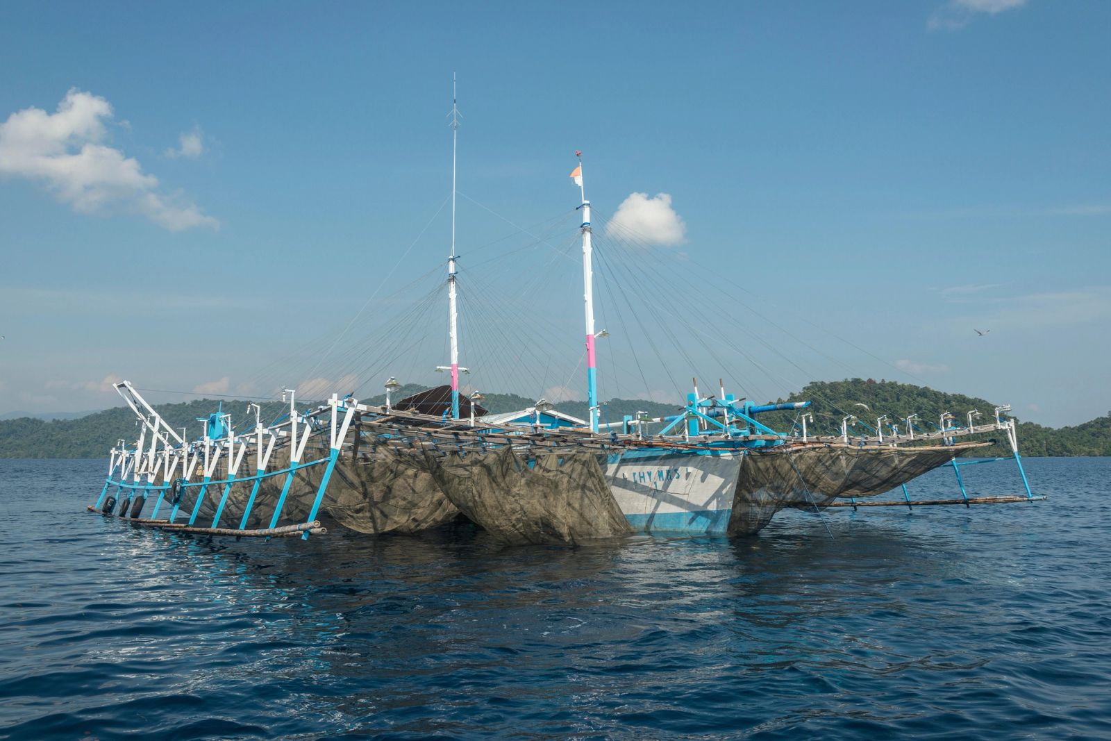 A bagan fishing platform on calm water in Cenderawasih Bay