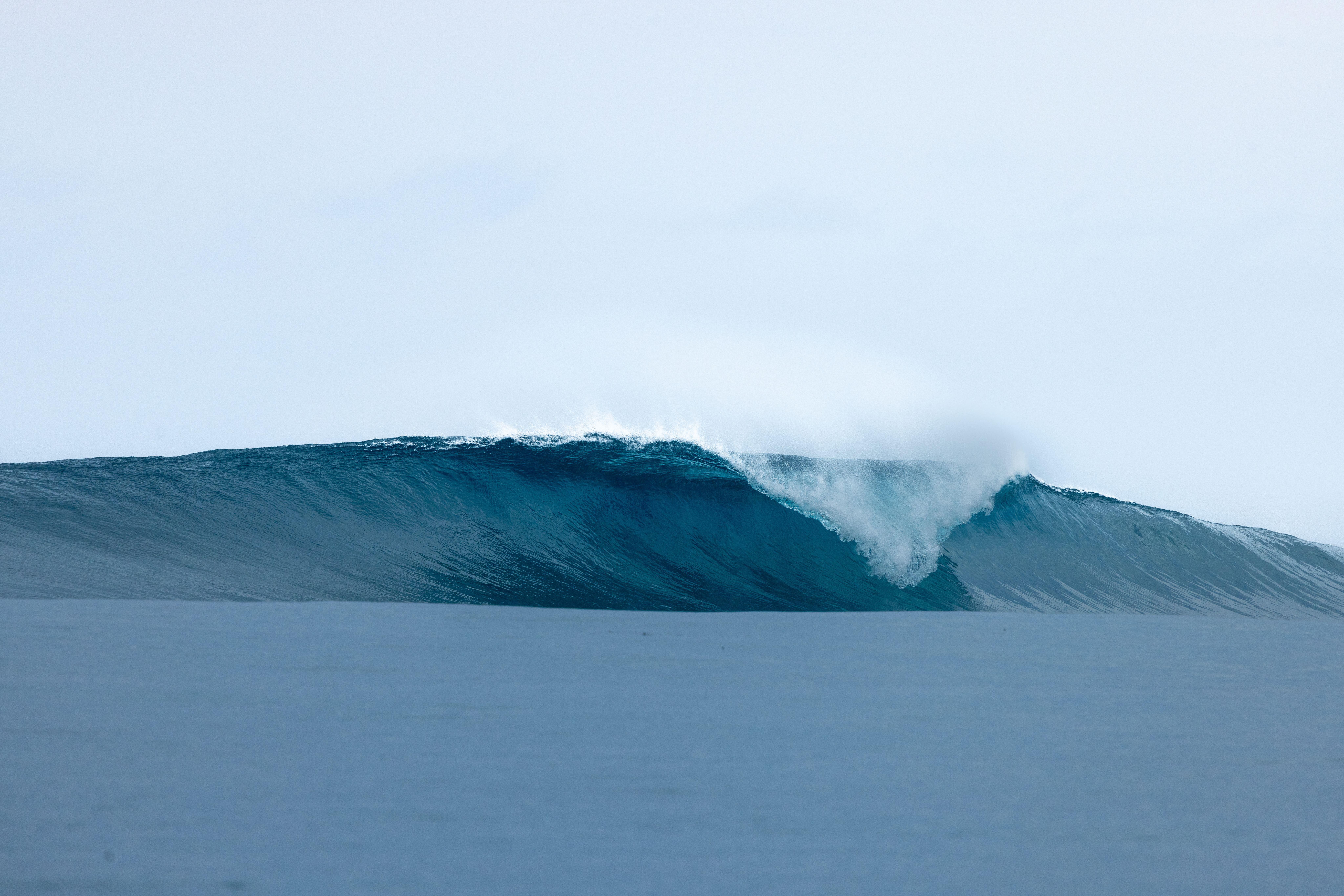 A clean, empty wave peeling over a shallow Mentawai reef