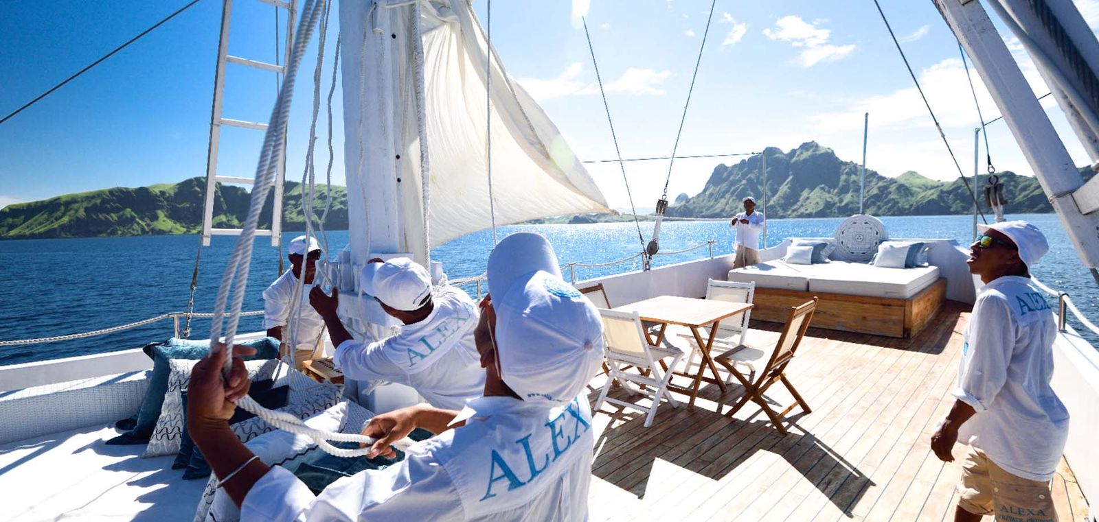 Alexa crew hoisting the sails.
