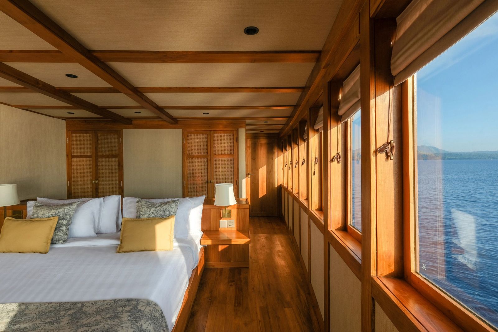 The owner's stateroom on Celestia with the sea visible through the windows.