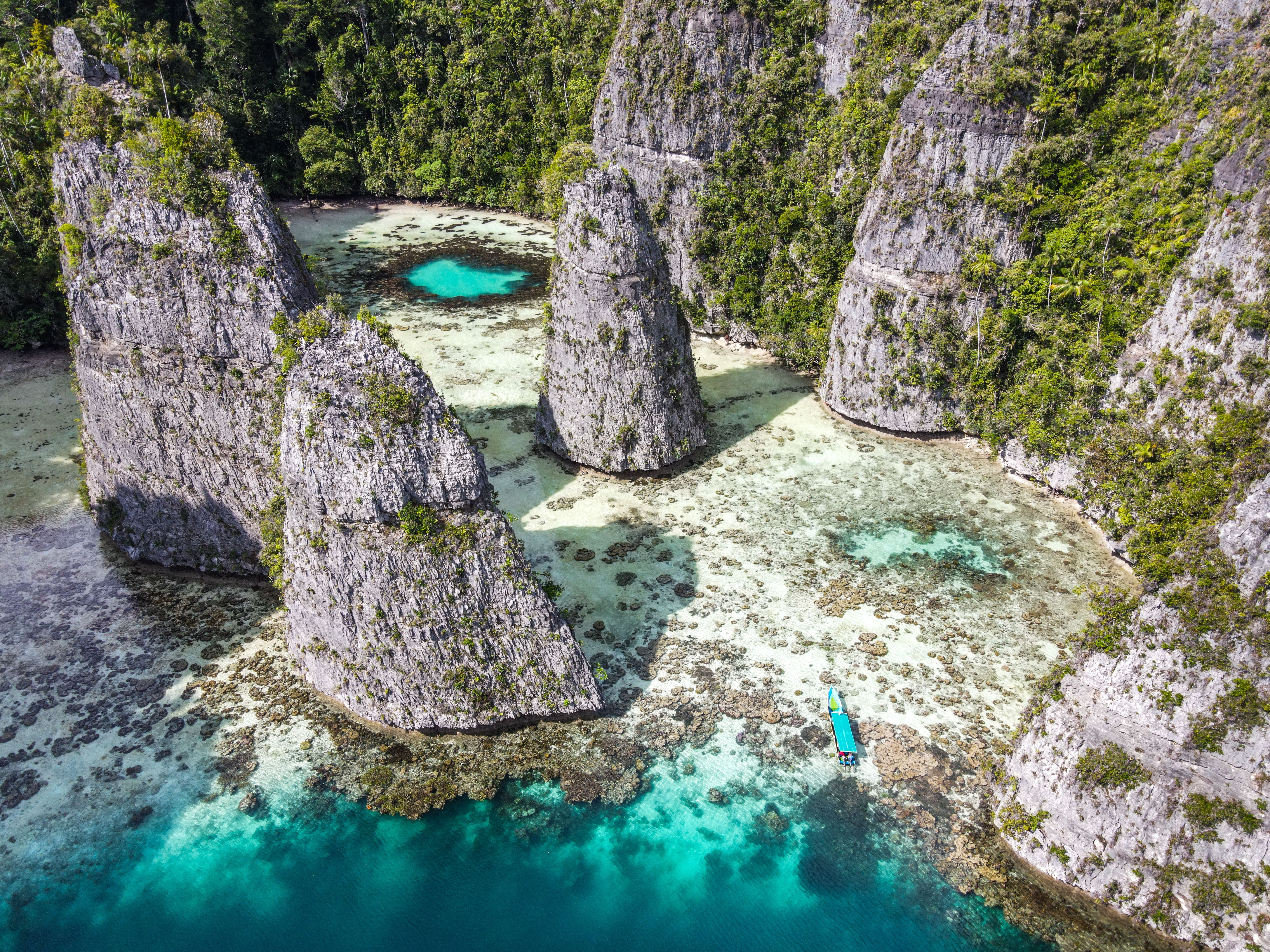 Aerial view of Pulau Balbulol in Misool, Raja Ampat, with turquoise lagoons among limestone islands