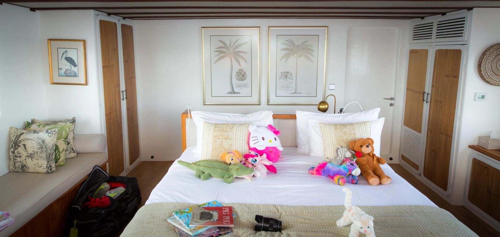 Yacht charter guest diving with an instructor amid the colorful coral of Wakatobi
