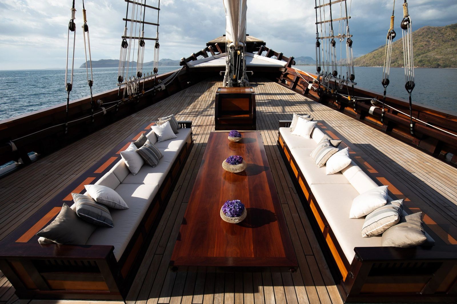 Golden light on Dunia Baru's foredeck lounge