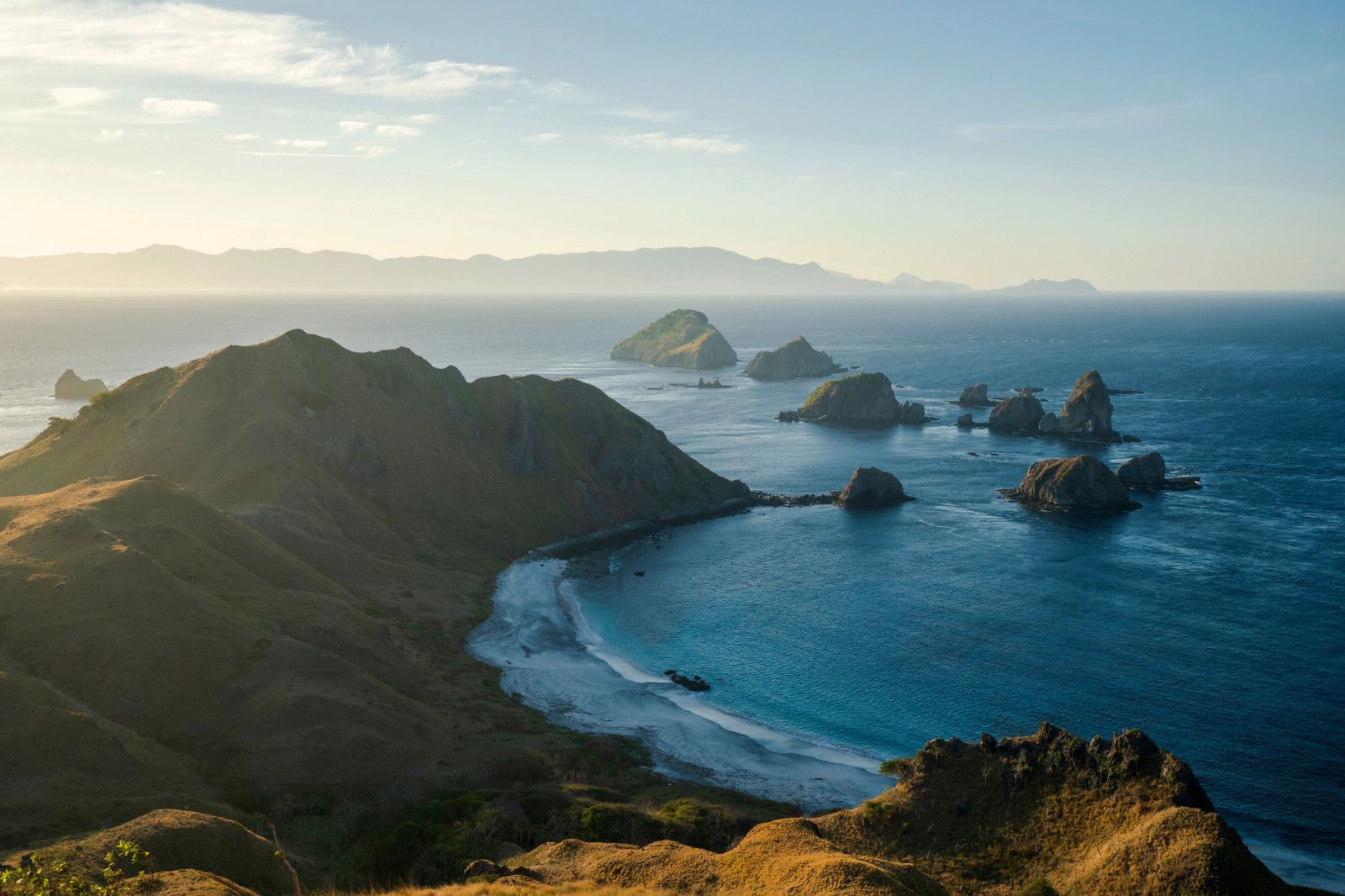 The golden headlands and sea stacks of the Sumbawa coast