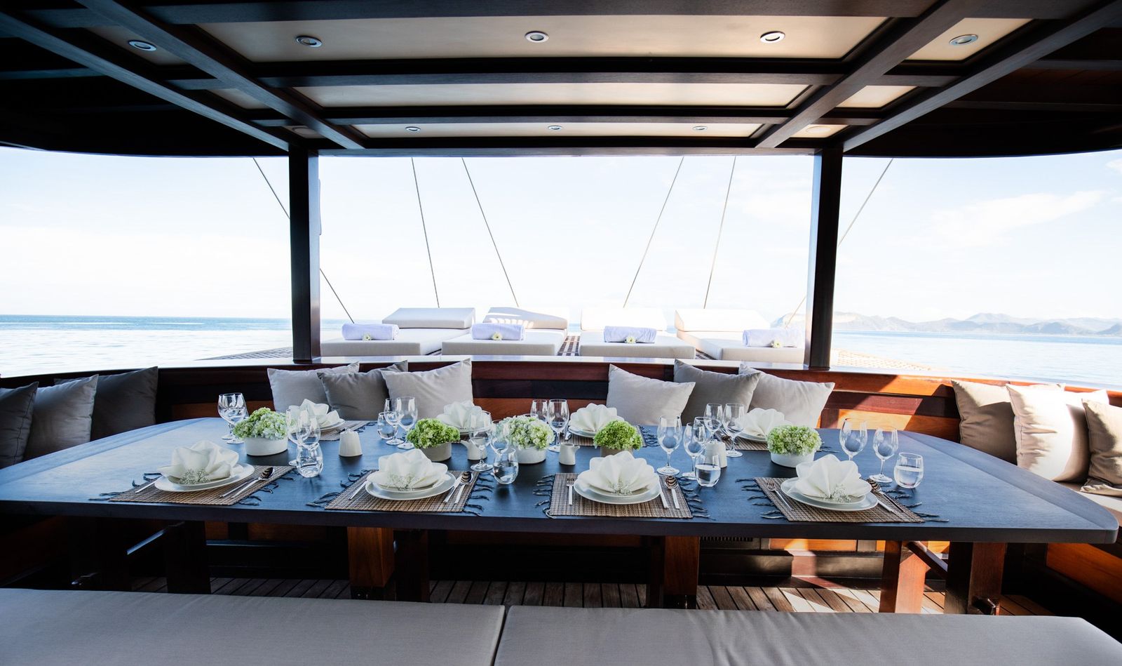 A dining table set at the bow