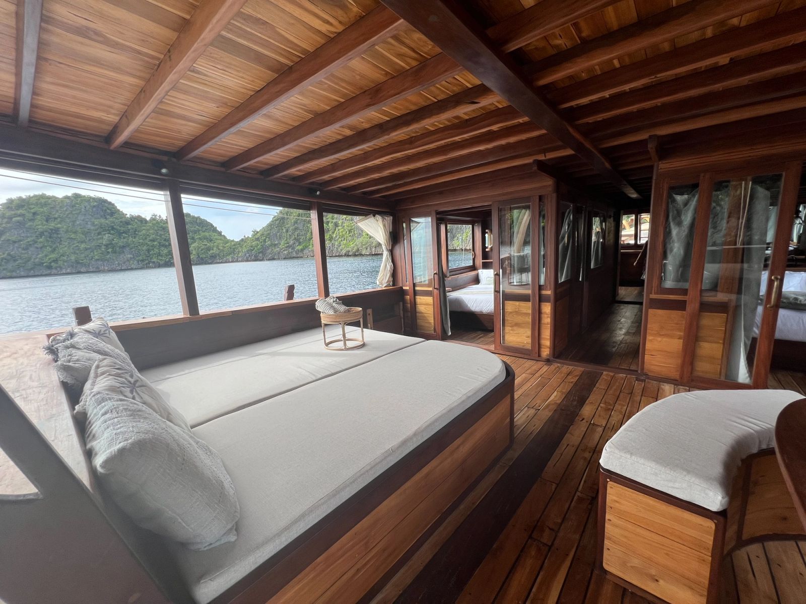 A daybed and curved bench on the chill deck of Dewata.