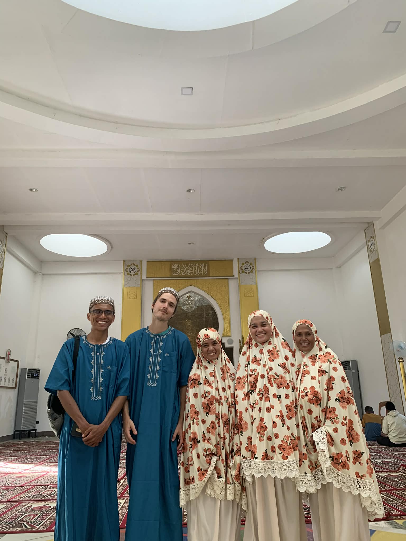 Visiting a friend from SULADS in Tawi-Tawi, a Muslim area, wearing traditional clothing to show respect for their culture.