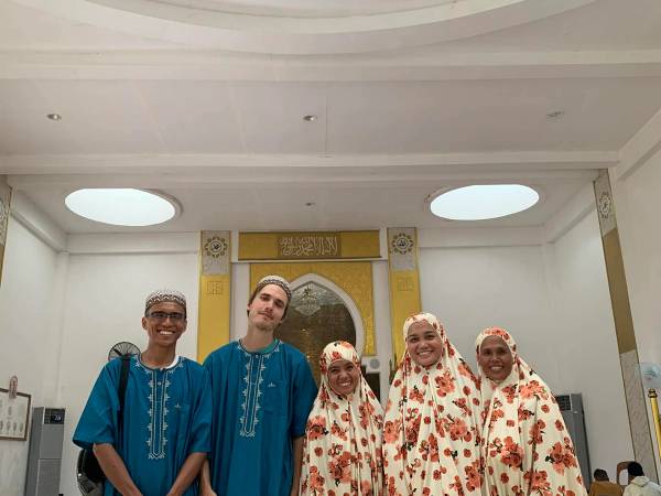Visiting a friend from SULADS in Tawi-Tawi, a Muslim area, wearing traditional clothing to show respect for their culture.