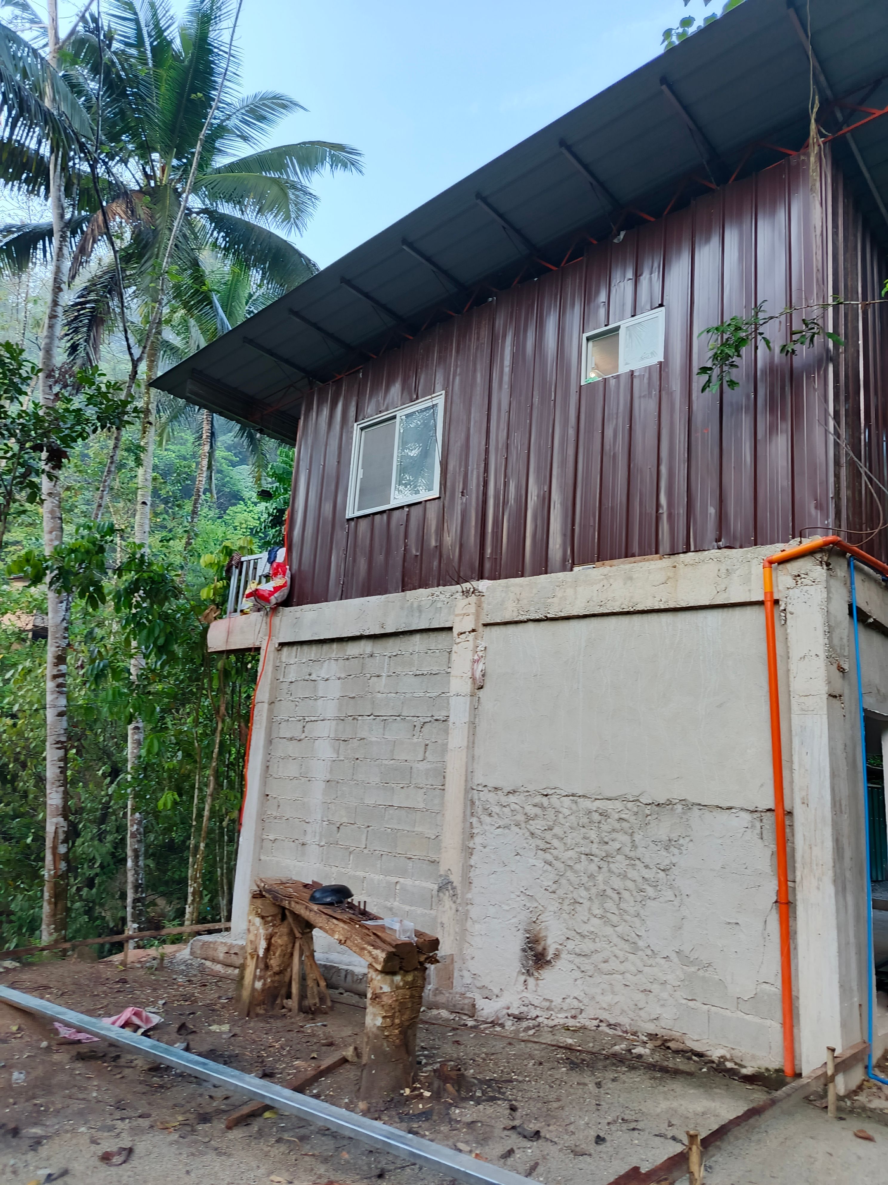 The back portion of our worship building, where we pray and plan to construct a kitchen area.