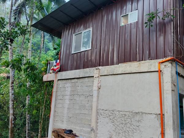 The back portion of our worship building, where we pray and plan to construct a kitchen area.