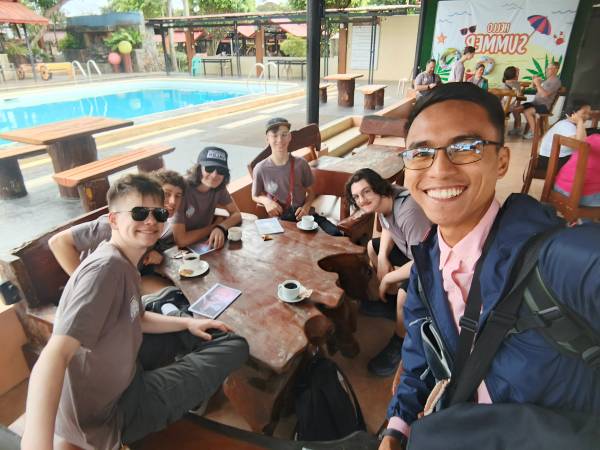 On the way to church on Sabbath, meeting young missionaries newly arrived from the United States and sharing books with them.