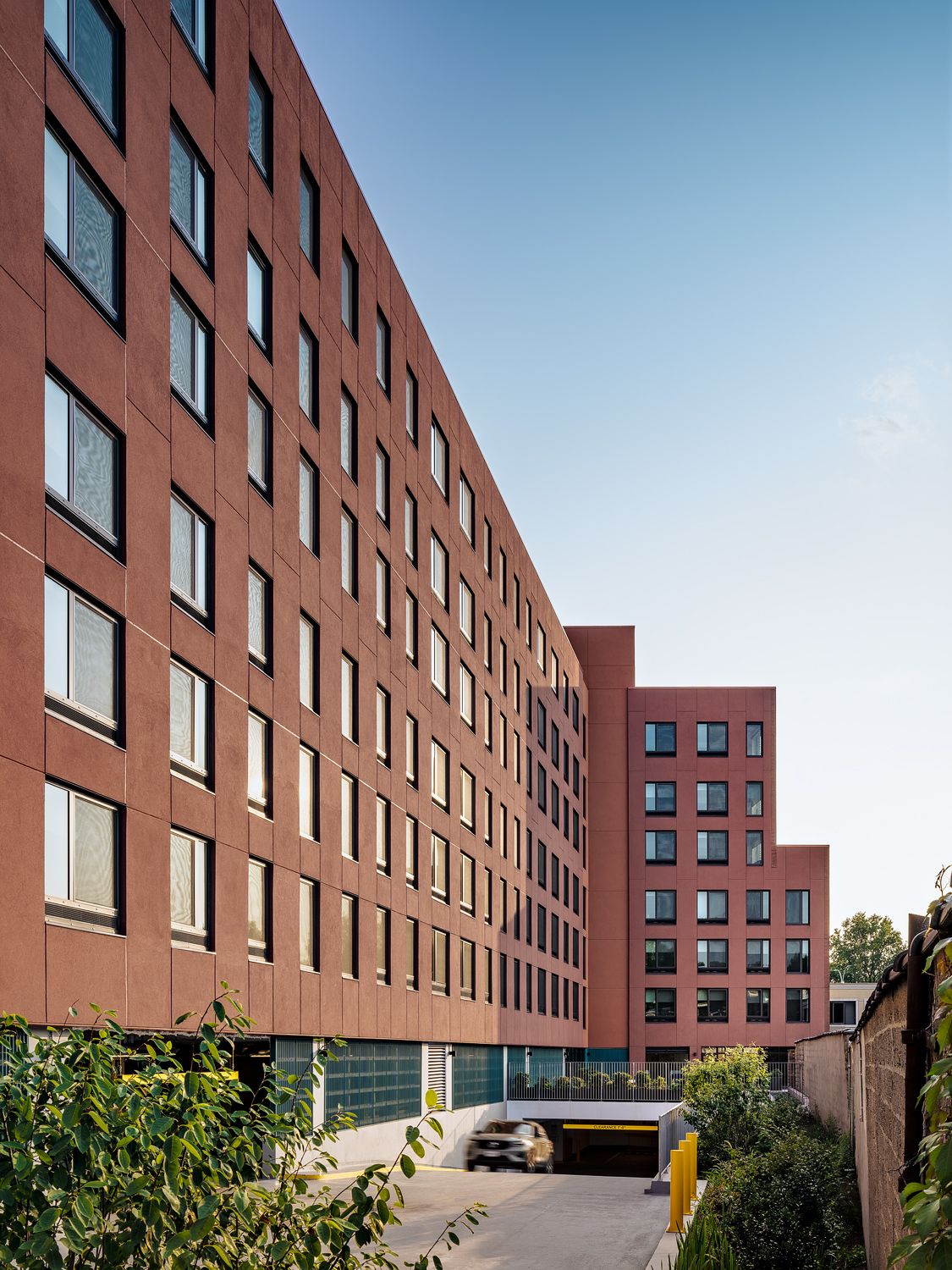 Parking is hidden underground at the rear of the building