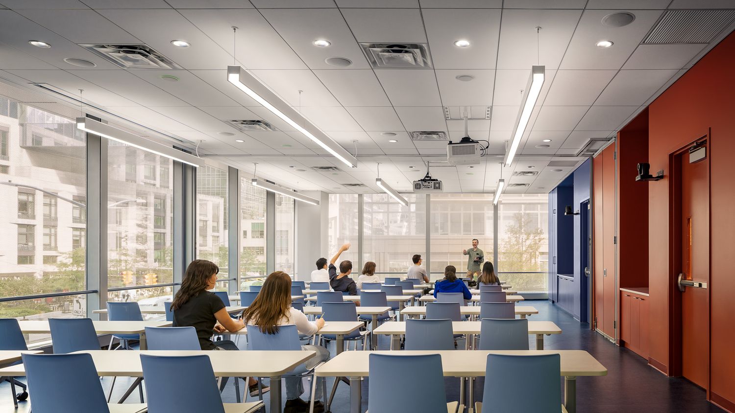 View of Multipurpose Room in lecture hall configuration, with people