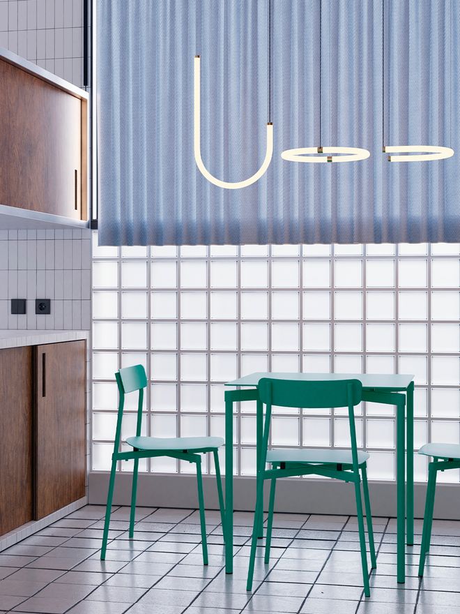 An image of green Fromme chairs and a green Fromme table in a kitchen.
