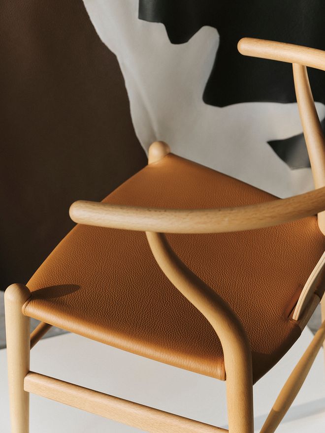 Wishbone chair upholstered in cognac leather