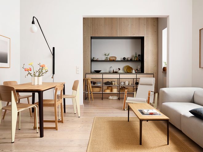 Vitra's Standard chairs, designed by Jean Prouvé, gathered around a dining table.