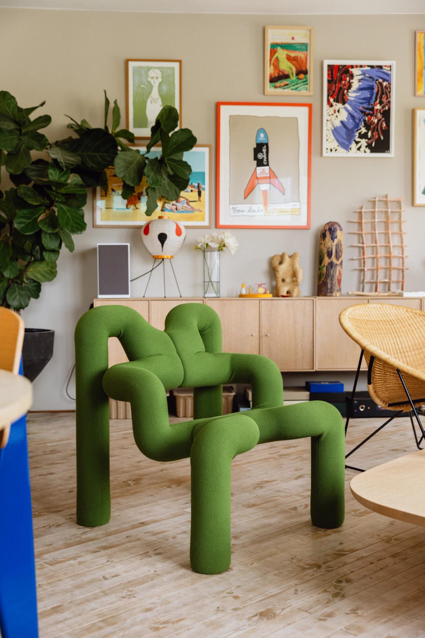 Photo of the Ekstrem lounge chair in a beautiful living room filled with art and other objects
