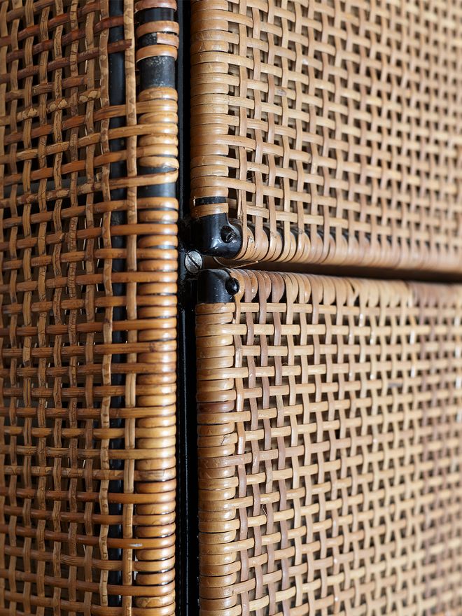 A detail of a cane-covered bannister 