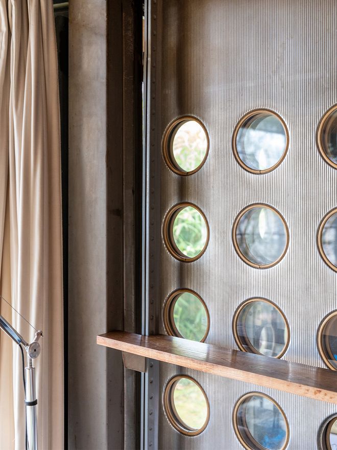 Portholes in aluminum panels typical of Jean Prouvé