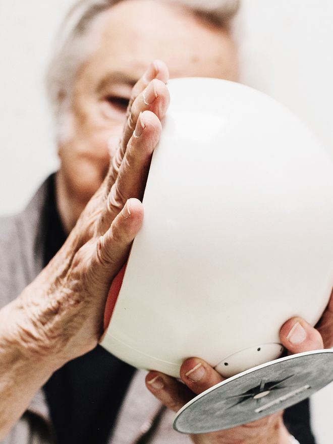 Eero Aarnio and a miniature Ball Chair