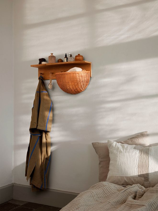 An image of ferm LIVING's Place rack and Braided wall pocket as part of the bedroom decor.