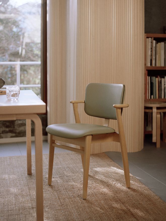 Green leather-upholstered Domus chair
