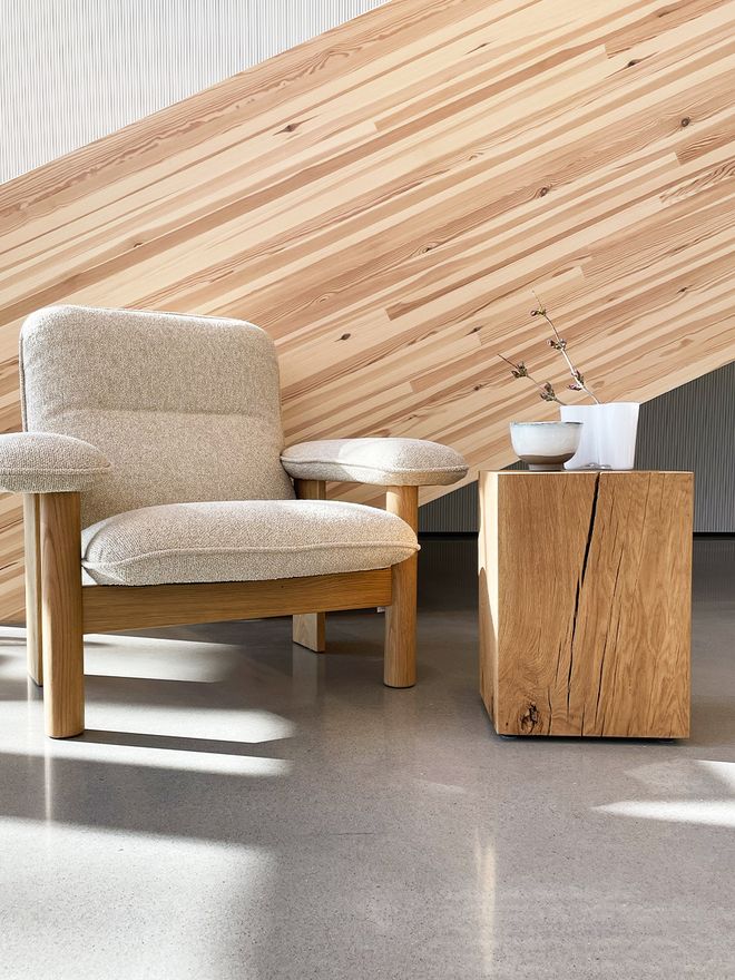 Nikari Biennale stool used as a side table next to Menu's Brasilia lounge chair
