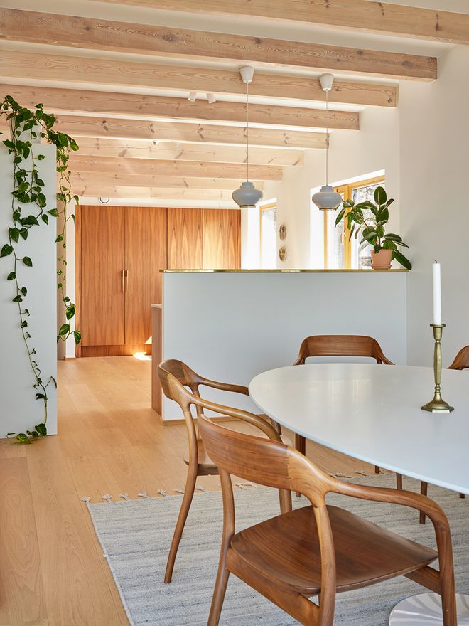 An open kitchen and a Knoll dining table