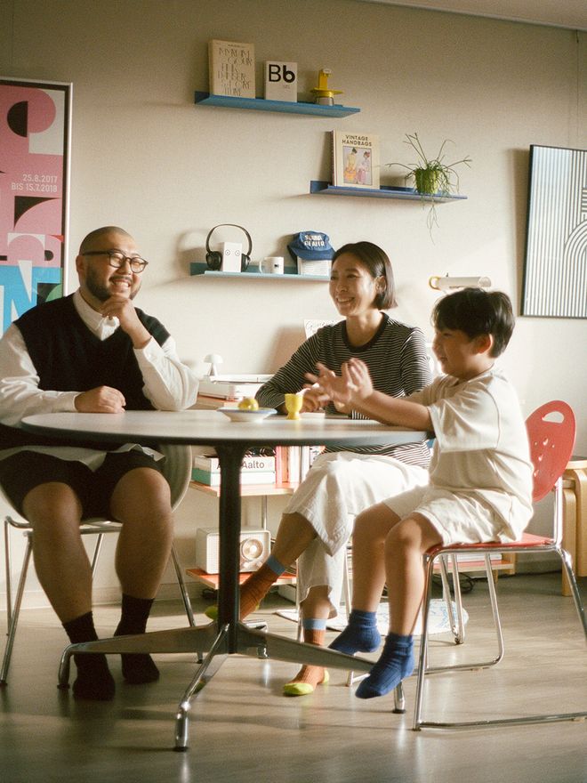 South-Korean family sitting around the dining table