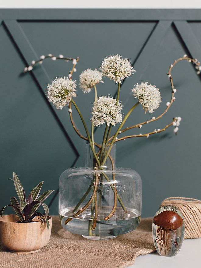 Marimekko's Ming vase filled with branches and flowers.
