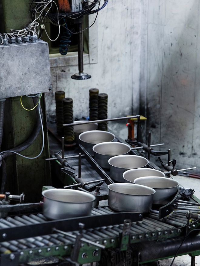 Steel pots on a production line